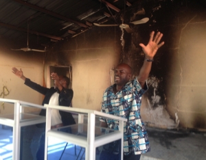 Nigerian Pastor Nelson Nwene continues to preach and worship in a church building bearing scorch marks from an attack in early January 2015.